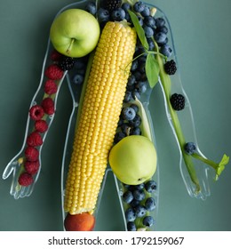 Closeup Of Plastic Human Body Full Of Fresh Fruit And Vegetables. Health Eating Illustration In Body Shape. Beautiful Raw Ingredients For Kids School Teaching Of Healthy Eating