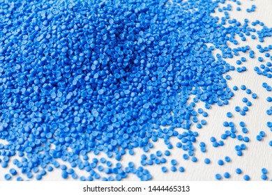 Close-up of plastic polymer granules, polymer plastic, polymer pallet. Plastic ball.