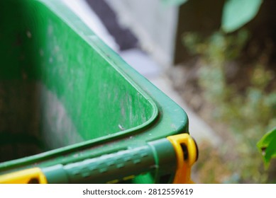 Close-up of a plastic storage container handle with a soft blurred background