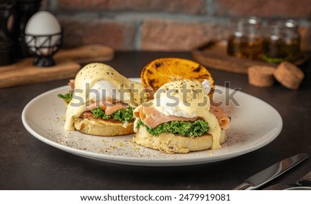 A closeup of a plate of eggs benedict