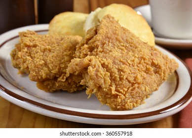 Closeup Of A Plate Of Fried Chicken With Biscuits