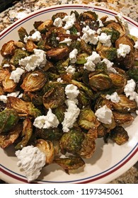 Close-up Of A Plate Of Golden Brown Deep Fried Brussels Sprouts With Goat Cheese..