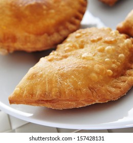 closeup of a plate with some spanish empanadillas, small meat or tuna pies, served as tapas