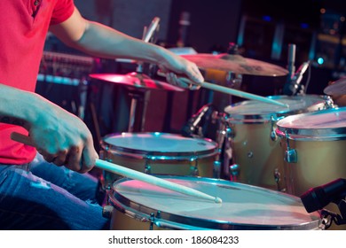 Close-up Of Playing On Drums