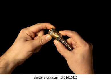 Closeup Of Plumber Hand Connect A Brass Fitting And High Pressure Plumbing Hose
