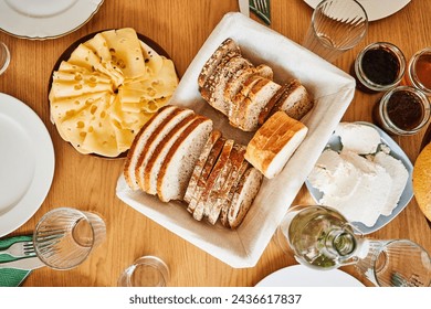 Close-up of polish breakfast table with cheese, bread, crud and jam
