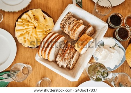 Close-up of polish breakfast table with cheese, bread, crud and jam