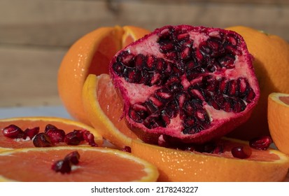 Closeup Of A Pomegranate With Cara Cara Navel Slices.