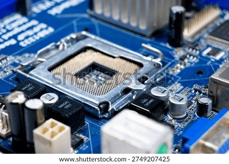 A close-up of a portion of the motherboard, with an empty processor socket