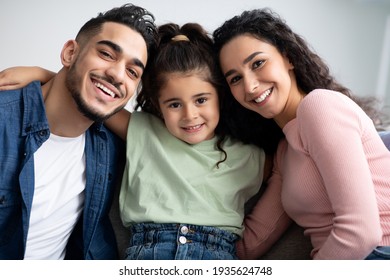 Closeup Portraif Of Happy Arabic Family Of Three With Little Daughter