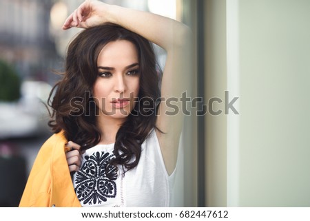 Close-up portrait of young brunette woman