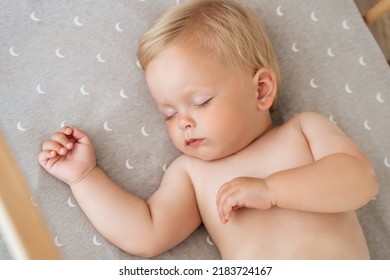 Closeup Portrait Of Adorable Baby Boy Napping In His Bed After Active Play In His Bedroom. Childcare Concept. Nap Time. Safe Healthy Sleep