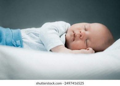 Close-up portrait of adorable baby boy sleeping in bed, 1 year old baby concept - Powered by Shutterstock