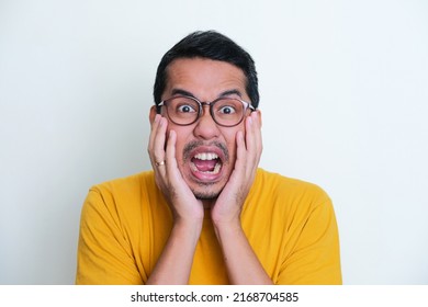 Closeup Portrait Of Adult Asian Man Screaming Scared