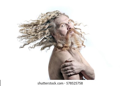 Closeup Portrait Of An Adult Red-haired Man With Long Wavy Hair And Beard On White Background