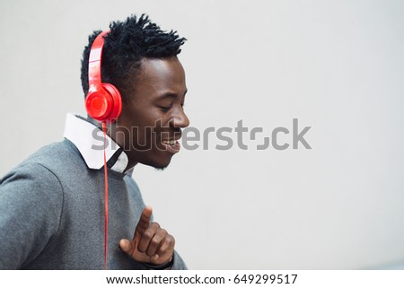 Similar – Young happy black man is listening to music