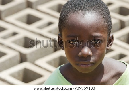 Close-up Portrait of African black Boy outdoors as a Child Labour Concept - Working Children