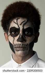 Closeup Portrait Of Afro Latino With Painted Face Looking At Camera