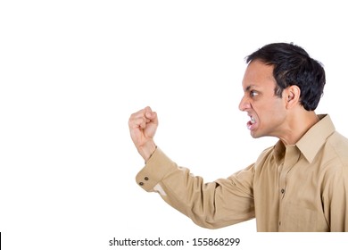 Closeup Portrait Of Angry Man Screaming, With Fist In Air, Isolated On White Background With Copy Space