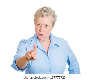Closeup portrait, angry, senior mature unhappy, serious woman pointing at someone, you did something wrong, bad boy, isolated white background. Negative human emotions, facial expressions, feelings