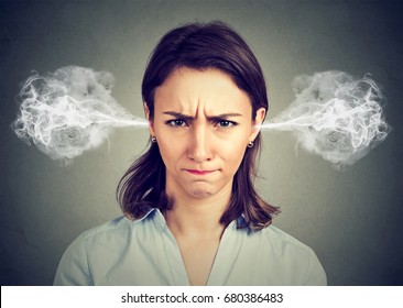 Closeup Portrait Of Angry Young Woman, Blowing Steam Coming Out Of Ears Isolated Gray Background. Negative Human Emotions Facial Expression Feelings