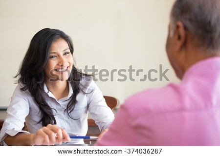 Closeup portrait, appointment with office manager, job interview, hiring, isolated indoors office background. Getting that first job or excellent customer service with a smile