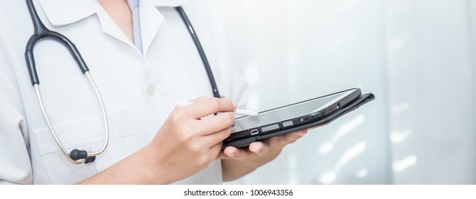 Closeup Portrait Of Asian Woman Doctor Hand Holding Ipad Gadget With Copy Space Over White Background. Healthcare And Medical People Sickness Concept Panoramic Banner