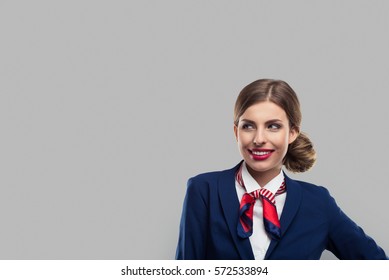 Closeup Portrait Of Attractive Flight Attendant. Stewardess Eyes To The Left.