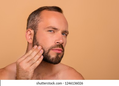 Close-up Portrait Of Attractive Handsome Man Touching Cheek After Applying Cream Lotion Flawless Smooth Fresh Clean Clear Perfect Shine Healthy Skin Isolated Over Beige Background