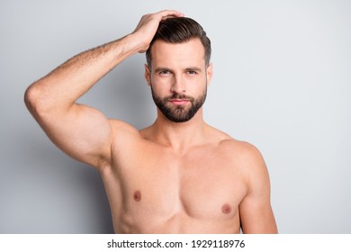 Close-up portrait of attractive perfect well-groomed fit brunet guy touching coiffure isolated over light grey color background