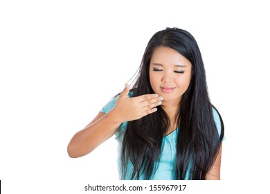 Closeup portrait of attractive woman wafting air to nostrils to smell better, isolated on white background - Shutterstock ID 155967917