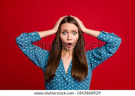Close-up portrait of attractive worried girl bad news reaction misery mistake isolated over bright red color background