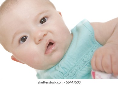 Closeup Portrait Of A Baby Girl Making A Funny Face