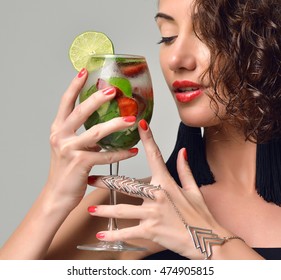 Closeup Portrait Of Bar Tender Woman With Mint And Strawberry Mojito Margarita Cocktail In Hand On Gray Background