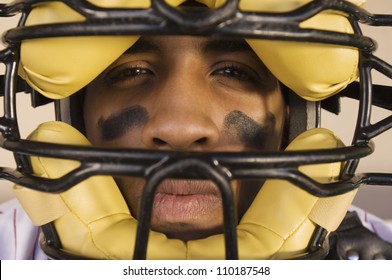 Close-up Portrait Of A Baseball Catcher Wearing Helmet