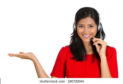 Closeup portrait of beautiful, adorable smiling female customer representative with phone headset pointing at copy space isolated on white background. Positive human emotions, facial expressions