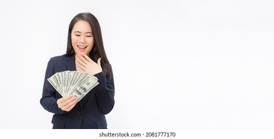 Closeup Portrait Of Beautiful Asian Business Woman Holding Money. Pretty Asian Girl Counting Her Salary Dollar Note. Success Wealth Financial Business Cashflow Currency Bill Payment Concept