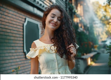 Close-up portrait of beautiful caucasian woman with charming smile walking, posing outdoors.  - Shutterstock ID 1177995340