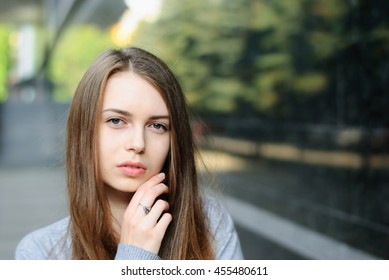 Closeup Portrait Of Beautiful Girl In Town, Very Shallow Depth Of Field