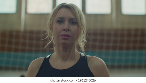 Close-up Portrait Of Beautiful Motivated Female Athlete Looking At Camera. Emotions, People And Active Youth Concept.