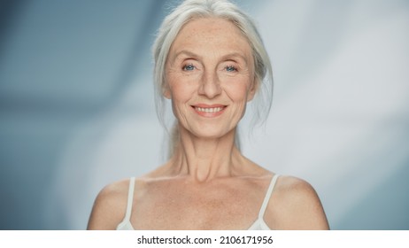 Close-up Portrait of Beautiful Senior Woman Looking at Camera and Smiling Wonderfully. Elderly Beauty. Graceful of Old Age Concept for Skincare, Cosmetics Product.