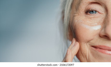 Close-up Portrait of Beautiful Senior Woman with Applied Under Eye Face Cream. Elderly Lady Makes Her Skin Soft, Smooth, Wrinkle Free with Natural anti-aging Cosmetics. Product for Beauty Skincare - Shutterstock ID 2106172097