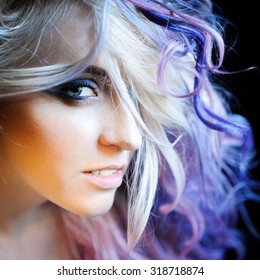 Close-up Portrait Of A Beautiful Sexy Young Blonde Girl Hipster With Lilac And Pink Hair On The Background Of Blooming Lilacs, Posing And With Bright Makeup