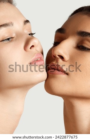 Close-up portrait of beautiful tender girls with different skin tones posing against white studio background. Foundation. Concept of natural beauty, cosmetology and cosmetics, skincare