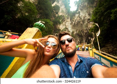 Close-up Portrait Of Beautiful Travel Couple,wear Casual Hipster Outfit,make Selfie Of Their Trip,positive Mood,happy Couple,couple Wear Sunglasses,shows Tongue,crazy Self Portrait,emotional People  