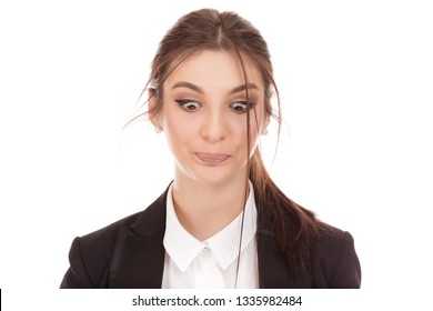 Closeup Portrait Of A Beautiful Woman Looking Down Puzzled And Confused, With Funny Face, Girl Wearing Business Wear, Formal Black Suit, Shirt Cutout Isolated On White Background. Hey, Just Look Down.