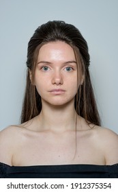 close-up portrait of a beautiful young brunette girl with long hair without makeup