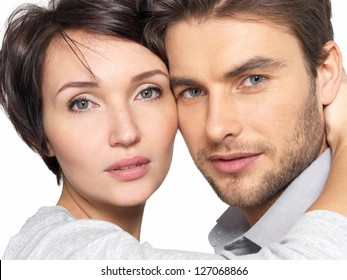 Closeup Portrait Of  Beautiful Young  Couple Isolated On White Background. Attractive Man And Woman Looking At Camera