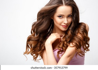 Close-up Portrait Of Beautiful Young Woman With Gorgeous Hair And Natural Makeup. Fashion Beauty Photo