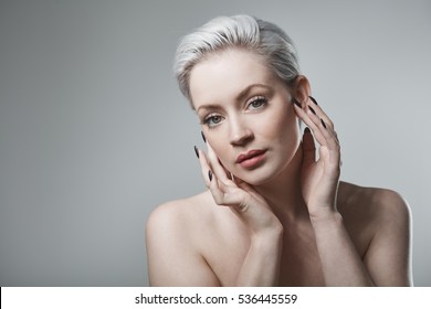 Closeup Portrait Of Beautiful Young Woman With Short Platinum Blonde Hair.